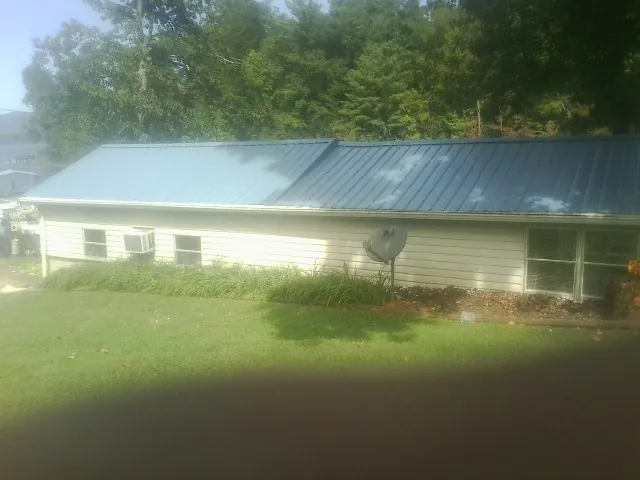 Blue metal roof running the length of a single story home in Grove City
